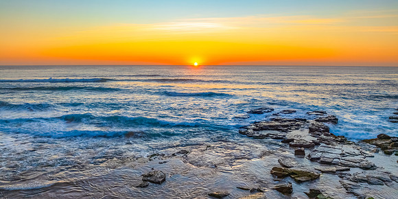 Sunrise at the Seaside with an Orange Horizon