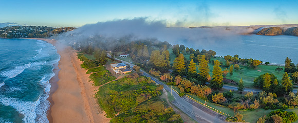 In-between - sunrise over the sea and water with fog
