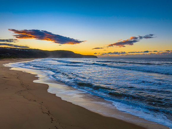 Aerial sunrise at the beach with clouds
