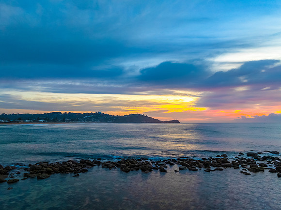 Aerial Sunrise Seascape Shrouded in Fog and High Clouds