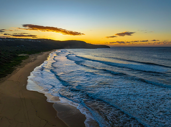 Aerial sunrise at the beach with clouds