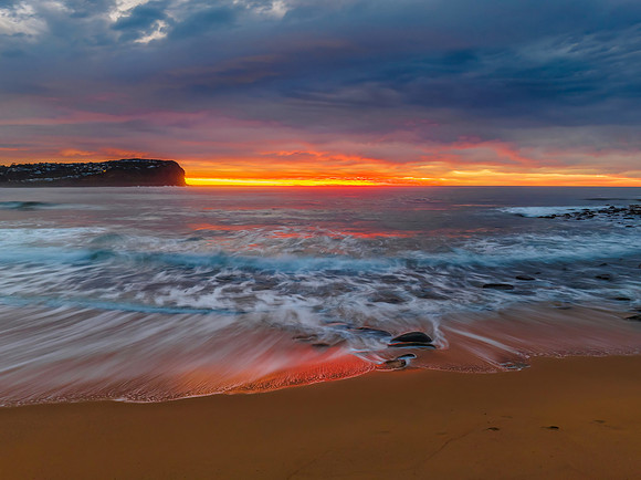 Cloud filled sunrise seascape