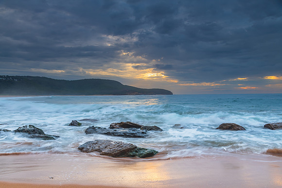 Sunrise at the seaside with rocks and beautiful diffused light