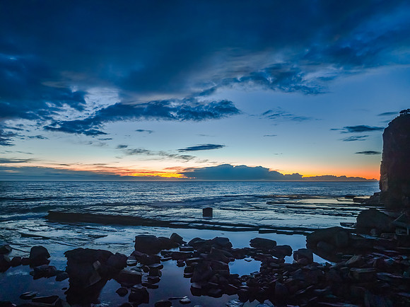 Sunrise over the ocean and rocky Inlet