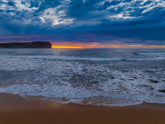 Cloud filled sunrise seascape