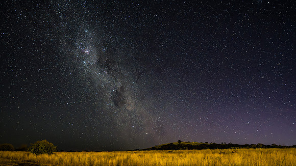 The night sky and Milky Way Galaxy with satellites