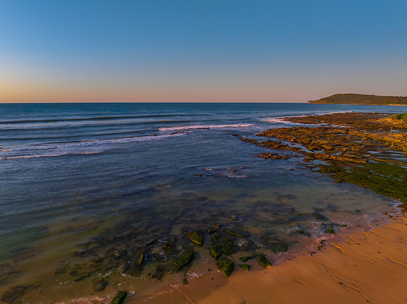 Aerial sunrise seascape with  clear skies