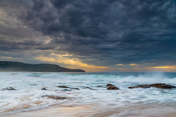 Sunrise at the seaside with rocks and beautiful diffused light