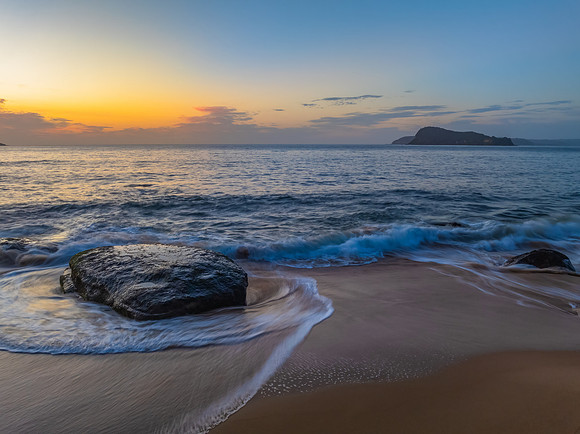 Aerial sunrise at the seaside with light scattered high cloud an