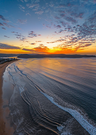 Sunrise seascape with pretty clouds in the sky