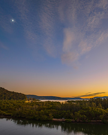 High cloud sunrise over the bay water