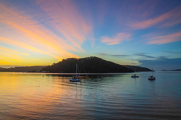 Aerial sunrise waterscape with boats