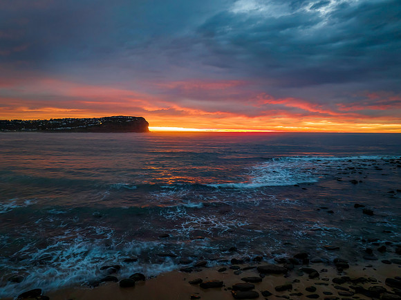 Cloud filled sunrise seascape