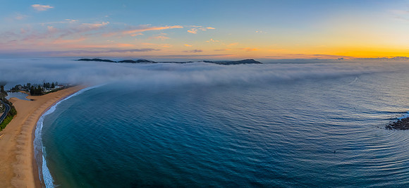 Foggy sunrise at the seaside