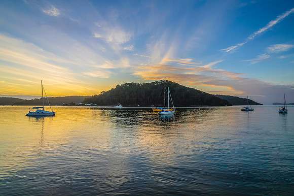 Aerial sunrise waterscape with boats