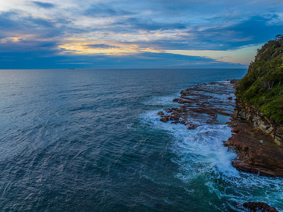 Aerial sunrise at the seaside with rock platform