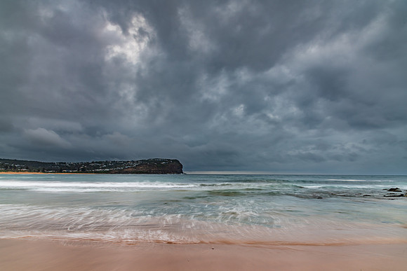 Rainy day sunrise at the beach