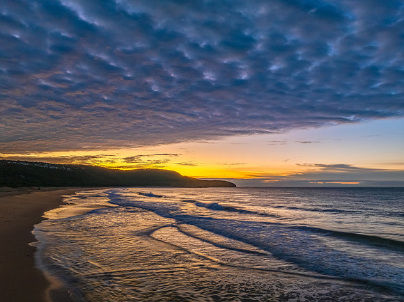 Winter seascape views over the beach with high and medium cloud