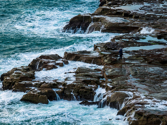 Aerial top down - photographer and the sea