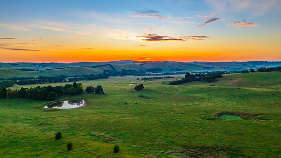 Sunrise panorama over the countryside with high cloud