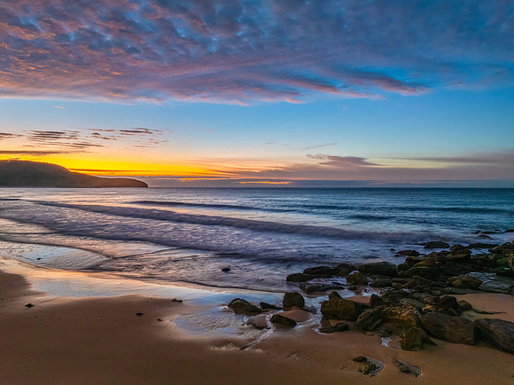 Winter seascape views over the beach with high and medium cloud