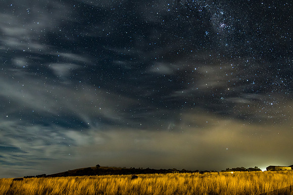 Stargazing at the night sky and milky way with high cloud