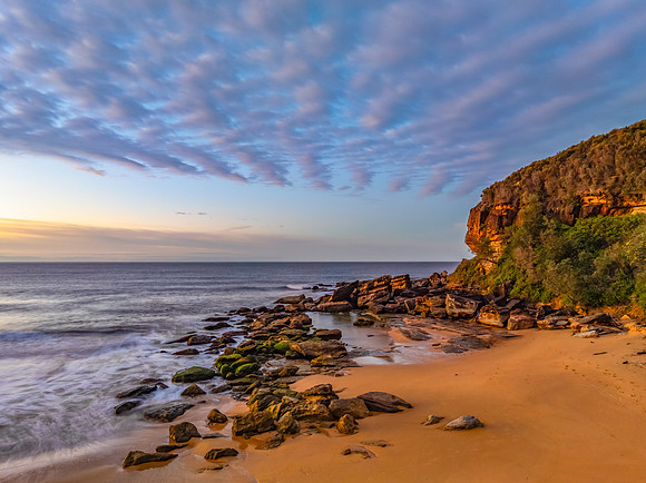 Winter seascape views over the beach with high and medium cloud