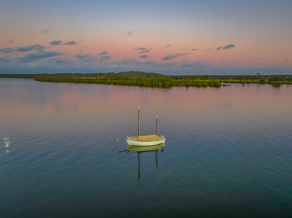 Sunset over the river with boats