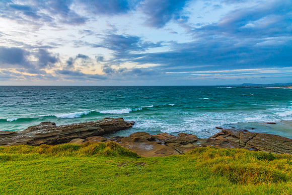 Sunrise seascape with strong southerly winds