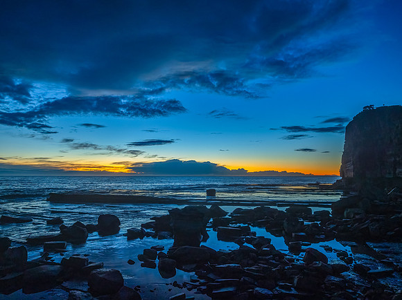 Sunrise over the ocean and rocky Inlet