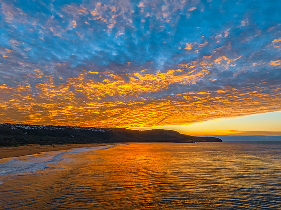 Winter seascape views over the beach with high and medium cloud