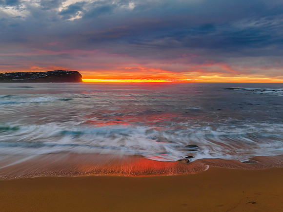 Cloud filled sunrise seascape