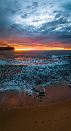 Cloud filled sunrise seascape