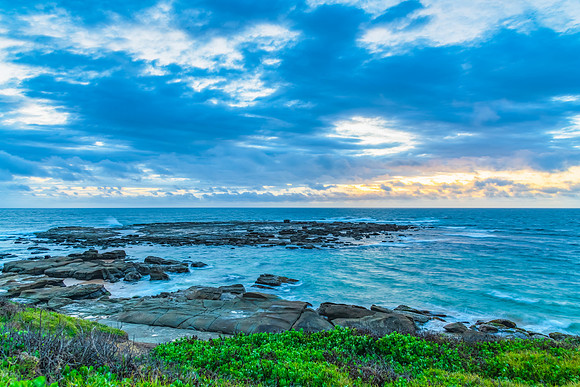 Sunrise seascape with strong southerly winds