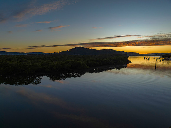 High cloud sunrise over the bay water