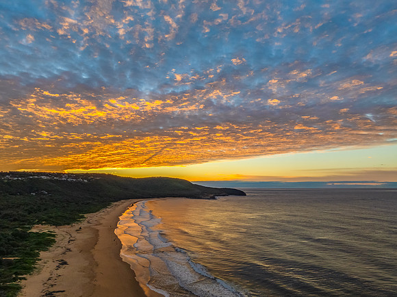 Winter seascape views over the beach with high and medium cloud