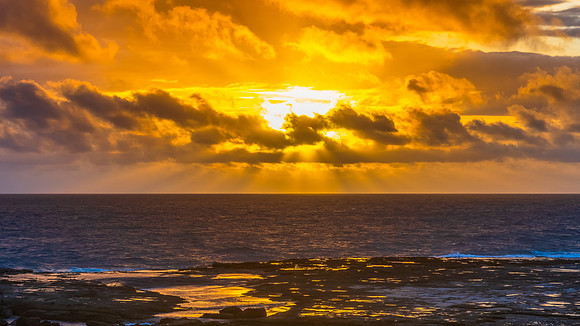 Sunrise seascape with strong southerly winds