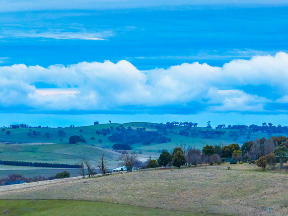 Twilight skies with cloud cover over the countryside