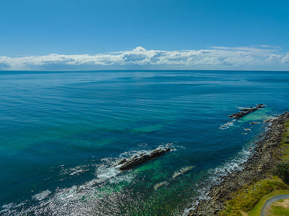 Cumulus clouds and the ocean on a beautiful Spring day