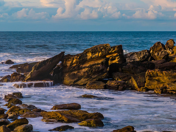Sea and rocks in the sunrise light