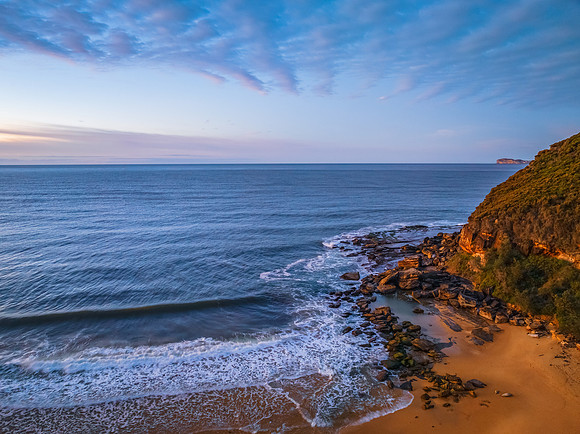 Winter seascape views over the beach with high and medium cloud