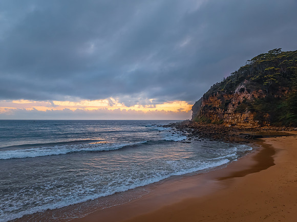 Cloud filled sunrise at the seaside