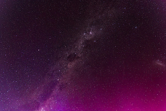Aurora Australis lights up the Milky Way predawn sky in pinks