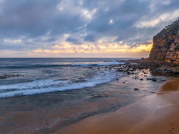Cloud filled sunrise at the seaside