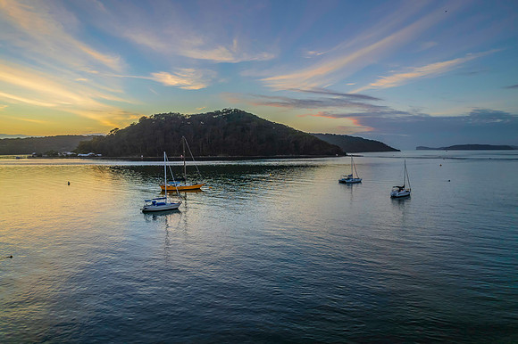 Aerial sunrise waterscape with boats