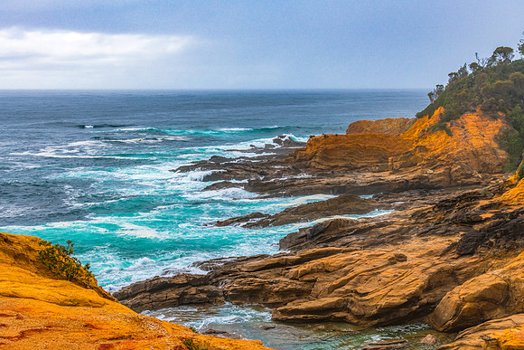 Overcast morning seascape with rocky headland at Bermagui