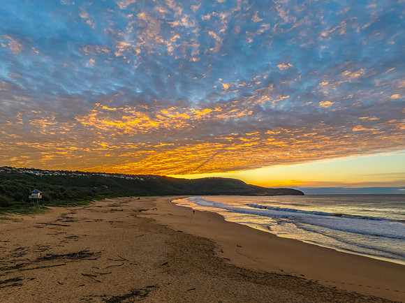 Winter seascape views over the beach with high and medium cloud