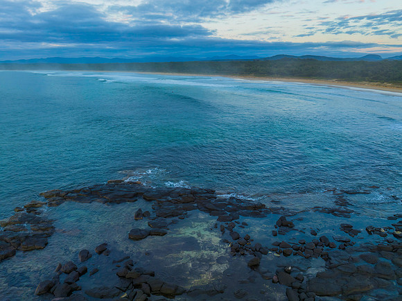 Sunrise with clouds and rocks