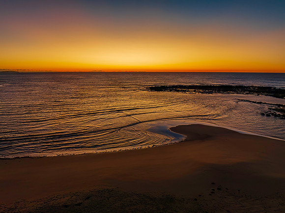 Aerial sunrise seascape with  clear skies