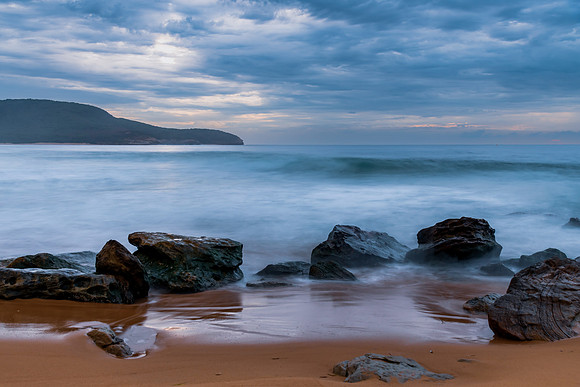 Sunrise at the seaside with rocks and beautiful diffused light